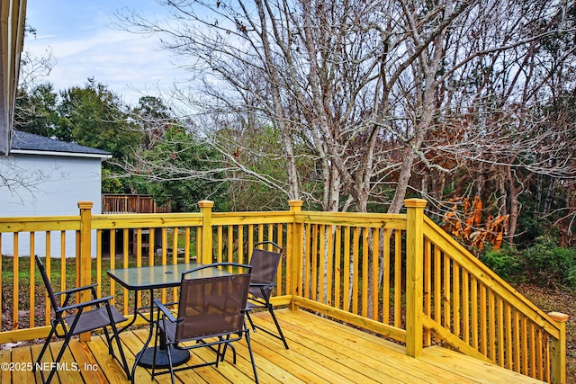 1573 Aletha Dr, Jacksonville, FL 32211 - wooden terrace featuring outdoor dining space and view of scattered trees