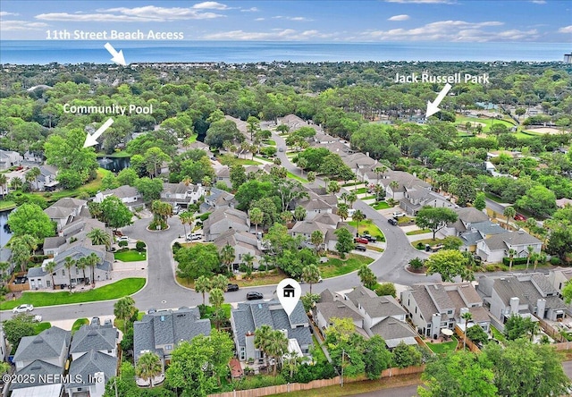 view of property location featuring nearby suburban area and a nearby body of water