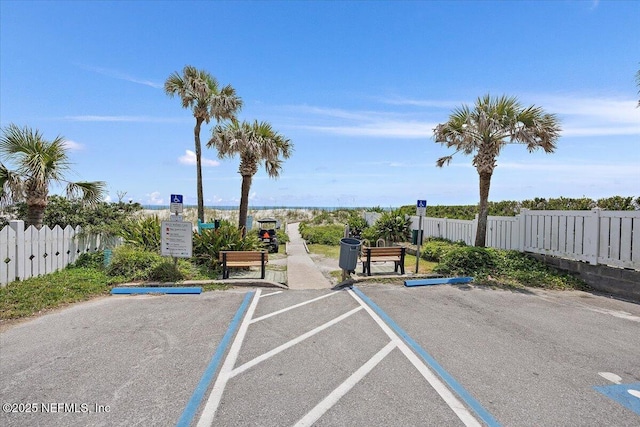 uncovered parking lot with fence