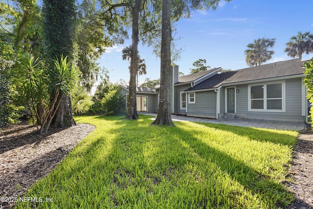 5105 Otter Creek Dr, Ponte Vedra Beach, FL 32082 - back of property with a yard and a chimney