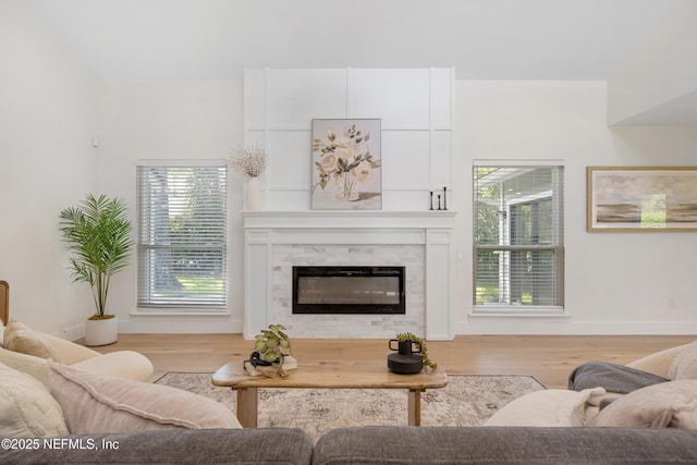 5105 Otter Creek Dr, Ponte Vedra Beach, FL 32082 - living room featuring wood finished floors, a premium fireplace, and baseboards