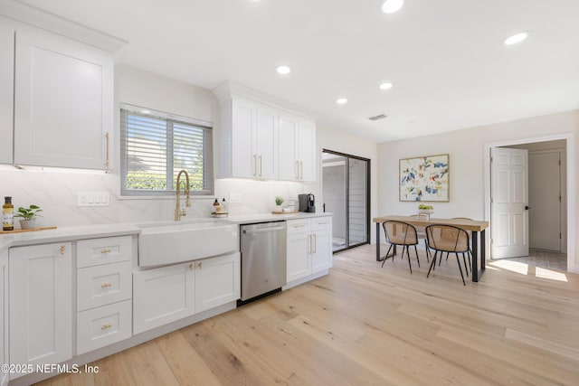 5105 Otter Creek Dr, Ponte Vedra Beach, FL 32082 - kitchen with stainless steel dishwasher, a sink, decorative backsplash, white cabinets, and recessed lighting