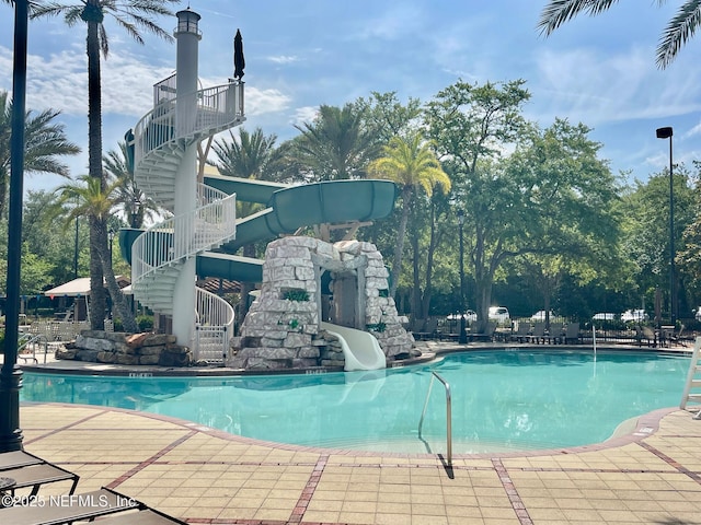 3931 Eagle Rock Rd, Middleburg, FL 32068 - community pool with a water slide and stairs