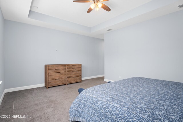3931 Eagle Rock Rd, Middleburg, FL 32068 - carpeted bedroom featuring baseboards, ceiling fan, and a raised ceiling