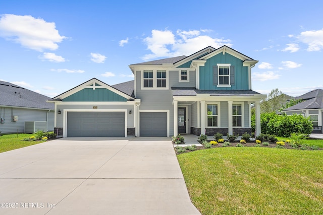 3931 Eagle Rock Rd, Middleburg, FL 32068 - view of front of property with board and batten siding, a front yard, driveway, stone siding, and an attached garage