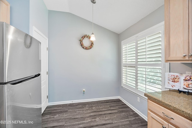 2120 Stone Creek Dr Unit E, Fleming Island, FL 32003 - kitchen with freestanding refrigerator, lofted ceiling, dark wood-type flooring, light brown cabinets, and baseboards