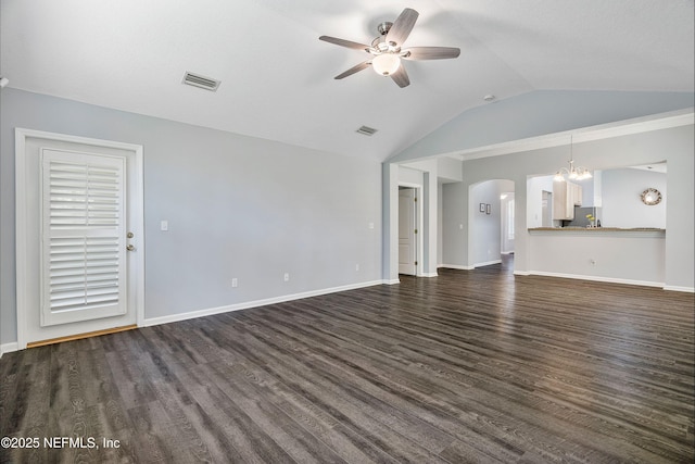 2120 Stone Creek Dr Unit E, Fleming Island, FL 32003 - unfurnished living room featuring arched walkways, ceiling fan, vaulted ceiling, dark wood-style floors, and baseboards