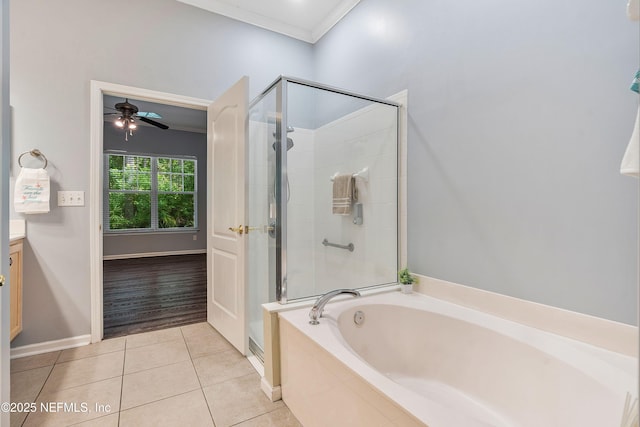 2120 Stone Creek Dr Unit E, Fleming Island, FL 32003 - full bathroom featuring a stall shower, tile patterned floors, a garden tub, vanity, and crown molding