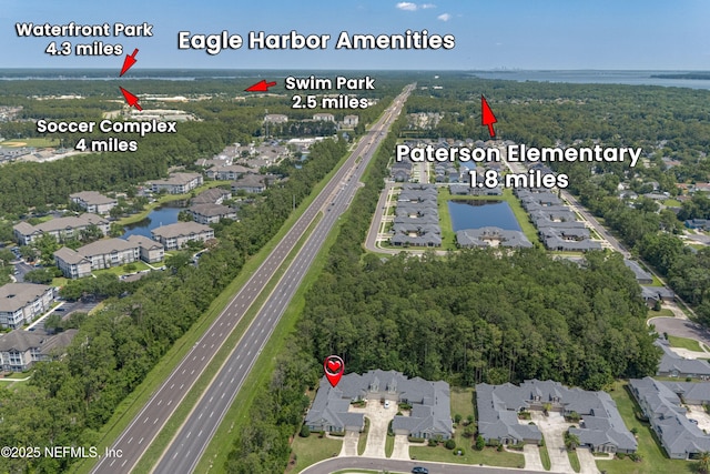 2120 Stone Creek Dr Unit E, Fleming Island, FL 32003 - aerial view of property and surrounding area featuring a highway, nearby suburban area, and a nearby body of water
