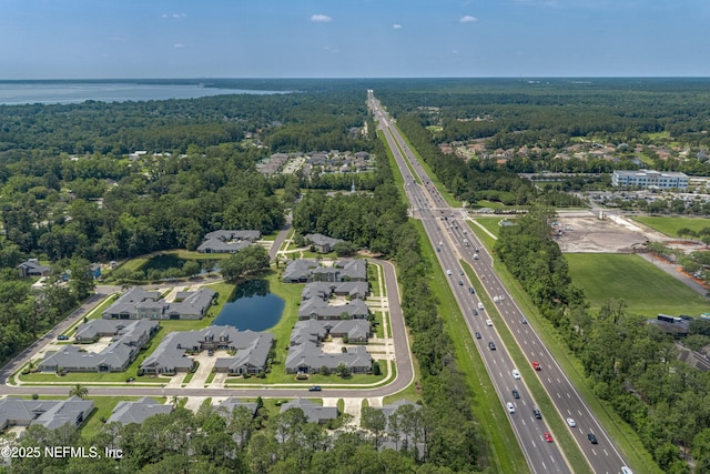 2120 Stone Creek Dr Unit E, Fleming Island, FL 32003 - aerial view of property and surrounding area featuring a major roadway, a nearby body of water, nearby suburban area, and a forest