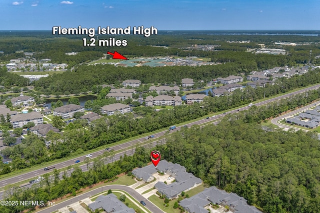 2120 Stone Creek Dr Unit E, Fleming Island, FL 32003 - aerial view of property's location with nearby suburban area and a heavily wooded area