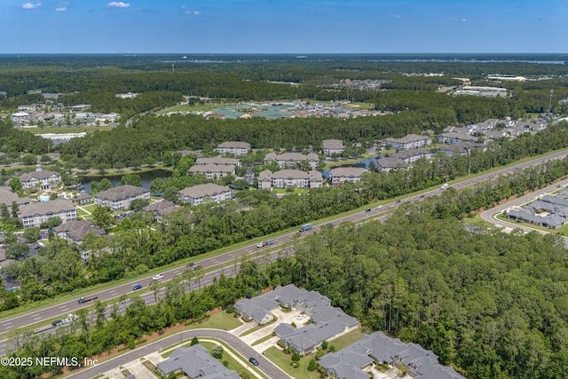2120 Stone Creek Dr Unit E, Fleming Island, FL 32003 - aerial view of property and surrounding area featuring nearby suburban area and a heavily wooded area