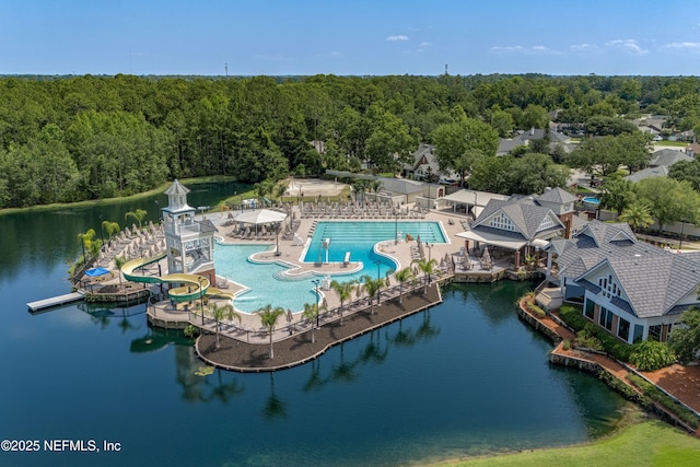 2120 Stone Creek Dr Unit E, Fleming Island, FL 32003 - drone / aerial view of a heavily wooded area, a pool area, and a large body of water