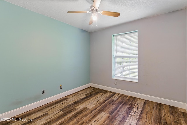12613 Deeder Ln, Jacksonville, FL 32258 - spare room featuring baseboards, dark wood finished floors, ceiling fan, and a textured ceiling