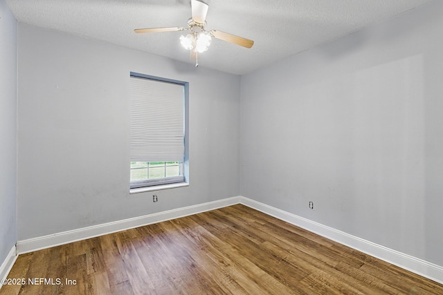 12613 Deeder Ln, Jacksonville, FL 32258 - empty room featuring wood finished floors, baseboards, a ceiling fan, and a textured ceiling