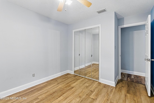 12613 Deeder Ln, Jacksonville, FL 32258 - unfurnished bedroom with light wood-type flooring, a closet, baseboards, and ceiling fan