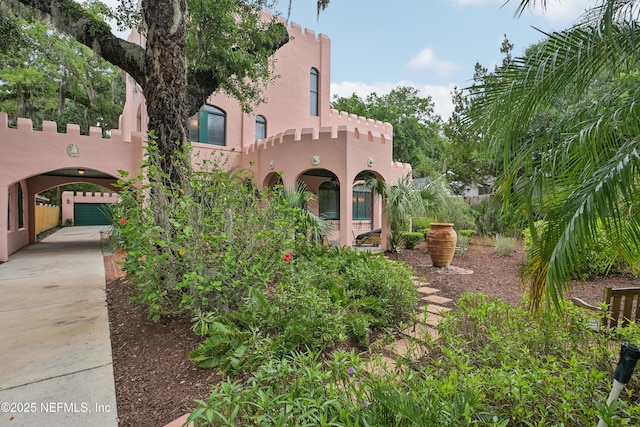 16 May St, Saint Augustine, FL 32084 - view of front of property with stucco siding and concrete driveway