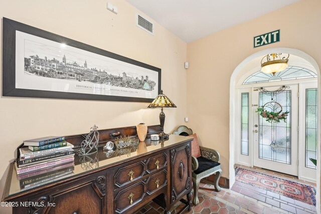 16 May St, Saint Augustine, FL 32084 - tiled entrance foyer featuring arched walkways and baseboards
