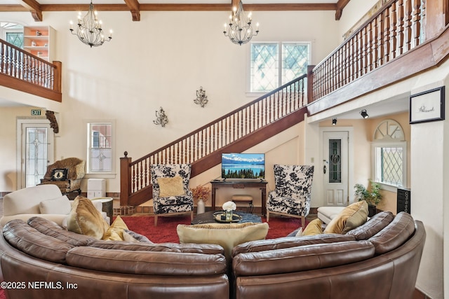 16 May St, Saint Augustine, FL 32084 - living area with a chandelier, stairs, a towering ceiling, and beam ceiling