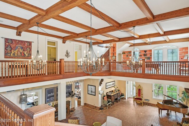 16 May St, Saint Augustine, FL 32084 - living room featuring a chandelier, coffered ceiling, beam ceiling, and baseboards