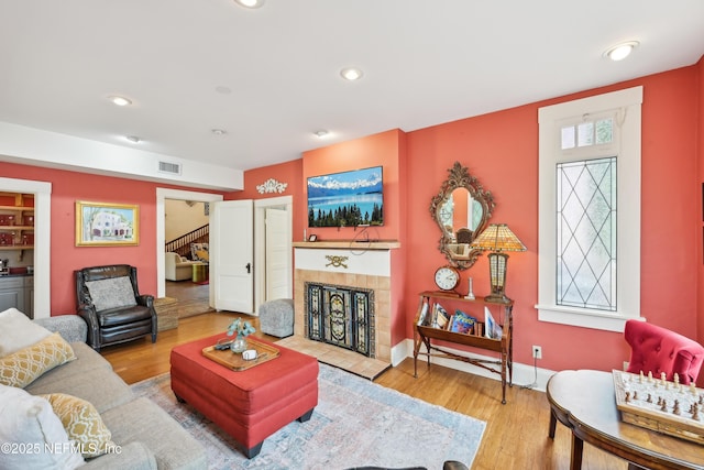 16 May St, Saint Augustine, FL 32084 - living room with wood finished floors, stairs, recessed lighting, a fireplace, and baseboards