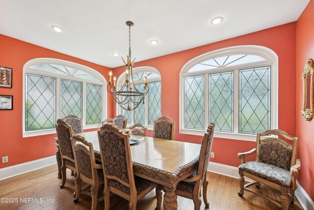 16 May St, Saint Augustine, FL 32084 - dining area featuring baseboards, wood finished floors, a chandelier, and recessed lighting