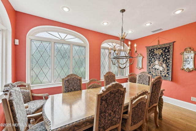 16 May St, Saint Augustine, FL 32084 - dining room with a chandelier, wood finished floors, recessed lighting, and baseboards
