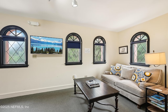 16 May St, Saint Augustine, FL 32084 - carpeted living area featuring baseboards