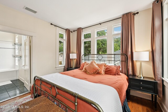 16 May St, Saint Augustine, FL 32084 - bedroom with wood finished floors and connected bathroom
