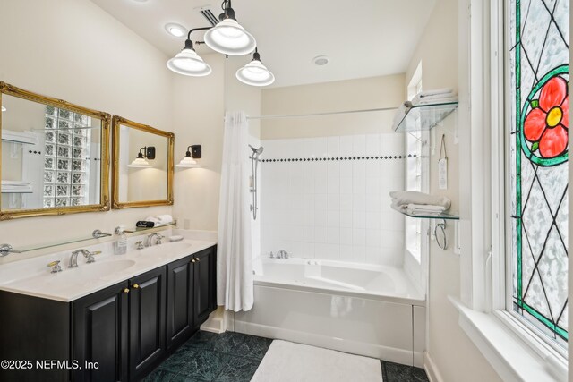 16 May St, Saint Augustine, FL 32084 - full bath with shower / bathtub combination with curtain, healthy amount of natural light, and double vanity