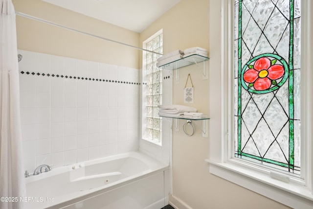 16 May St, Saint Augustine, FL 32084 - bathroom with baseboards and shower / bath combo with shower curtain