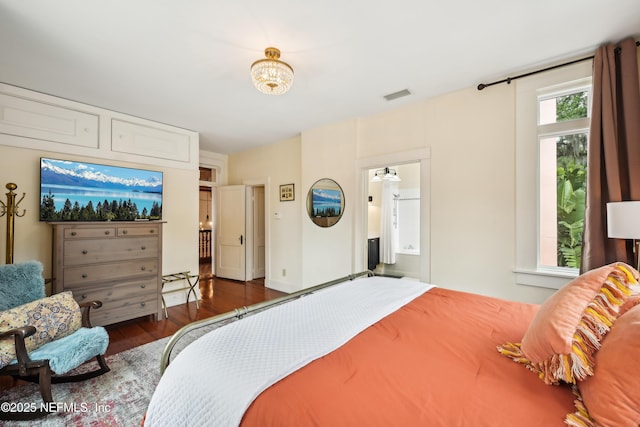 16 May St, Saint Augustine, FL 32084 - bedroom with wood finished floors and connected bathroom