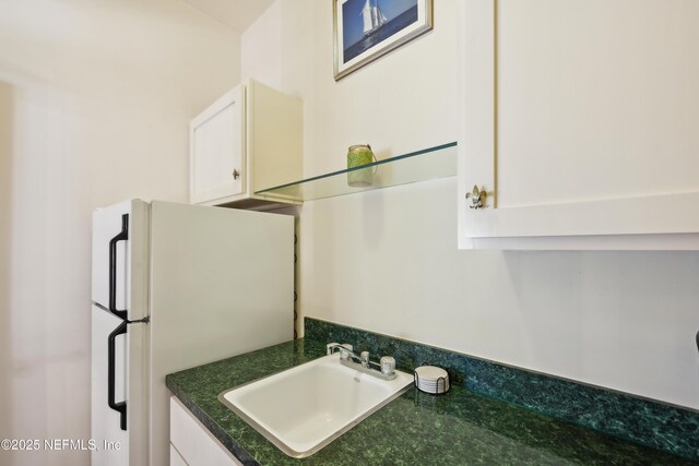 16 May St, Saint Augustine, FL 32084 - detailed view of a sink and freestanding refrigerator