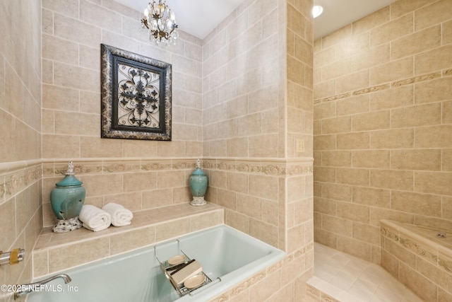 16 May St, Saint Augustine, FL 32084 - bathroom featuring a bath and a chandelier