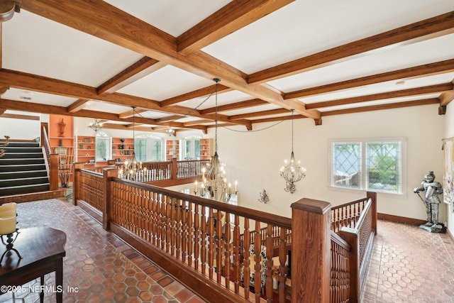 16 May St, Saint Augustine, FL 32084 - hallway with a chandelier, beamed ceiling, tile patterned floors, coffered ceiling, and an upstairs landing