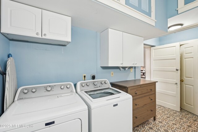 16 May St, Saint Augustine, FL 32084 - washroom with cabinet space and separate washer and dryer