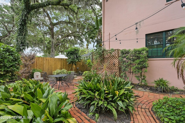 16 May St, Saint Augustine, FL 32084 - view of yard with a patio area, fence, and outdoor dining space