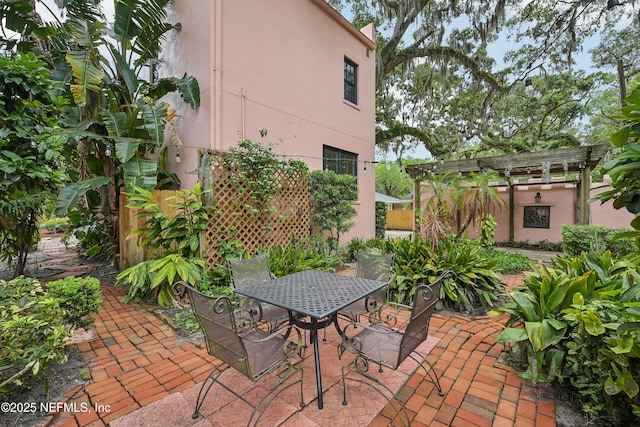16 May St, Saint Augustine, FL 32084 - view of patio / terrace with outdoor dining space and a pergola