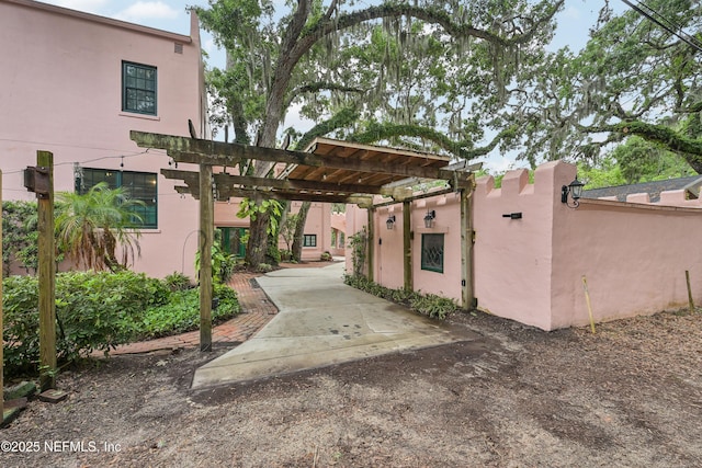 16 May St, Saint Augustine, FL 32084 - view of front facade featuring a gate, stucco siding, and fence