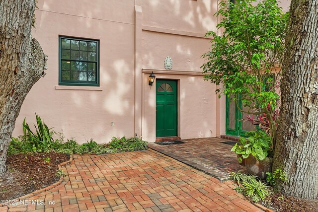 16 May St, Saint Augustine, FL 32084 - view of exterior entry featuring stucco siding