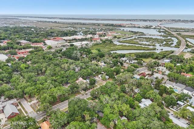 16 May St, Saint Augustine, FL 32084 - aerial view of property and surrounding area with a nearby body of water and a tree filled landscape