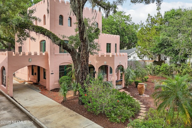 16 May St, Saint Augustine, FL 32084 - view of front of house featuring stucco siding and fence