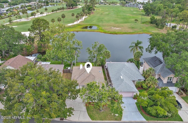 aerial view of residential area with a nearby body of water and a golf club