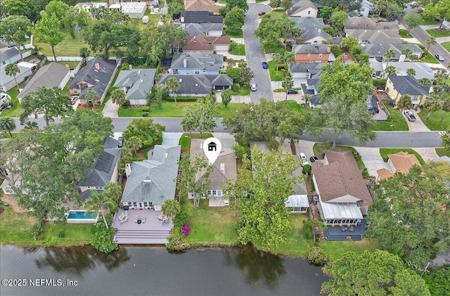 view of property location featuring nearby suburban area and a large body of water