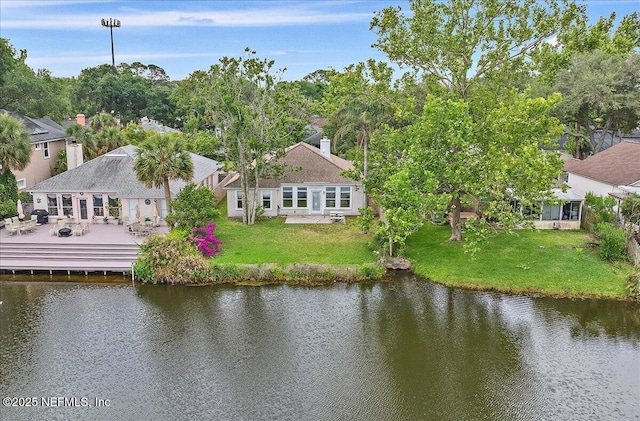 aerial view of property and surrounding area with a large body of water