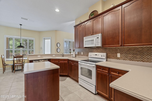 232 Porta Rosa Cir, Saint Augustine, FL 32092 - kitchen featuring white appliances, light tile patterned floors, light countertops, and recessed lighting