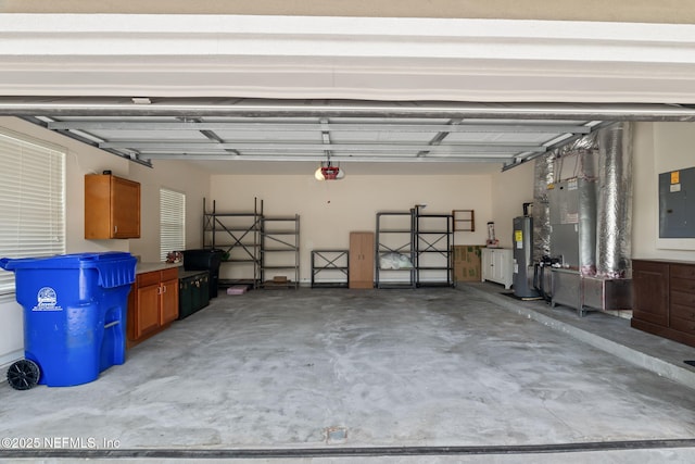 232 Porta Rosa Cir, Saint Augustine, FL 32092 - garage featuring water heater, electric panel, and a garage door opener