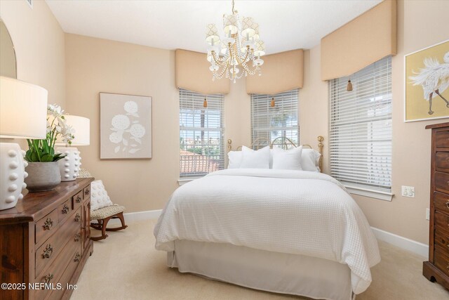 425 N Ocean Grande Dr Unit 205, Ponte Vedra Beach, FL 32082 - bedroom featuring light colored carpet, a chandelier, and baseboards