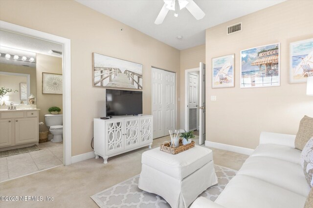 425 N Ocean Grande Dr Unit 205, Ponte Vedra Beach, FL 32082 - living room with ceiling fan, baseboards, and light colored carpet