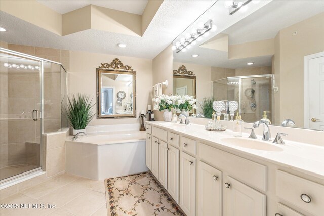 425 N Ocean Grande Dr Unit 205, Ponte Vedra Beach, FL 32082 - full bathroom featuring a shower stall, a bath, tile patterned flooring, double vanity, and recessed lighting